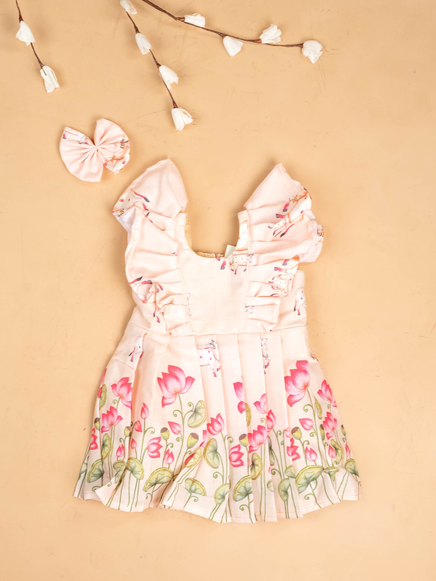 Peach -  Girls Pichwai Cow Printed  Frock With Matching Hair Clip