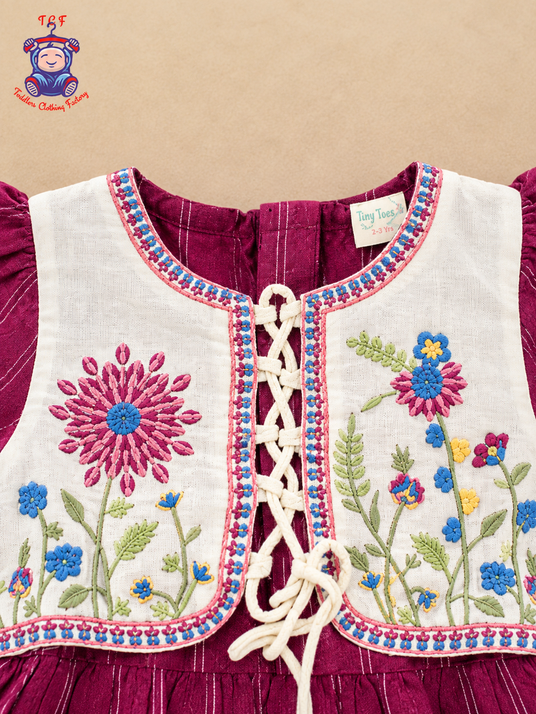 Girls Maroon & Cream Floral Embroidered Frock with Lace-Up Tassel Detail